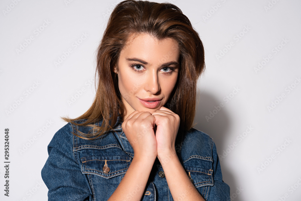 cheerful young woman looking at camera on white cheerful young woman looking at camera on white