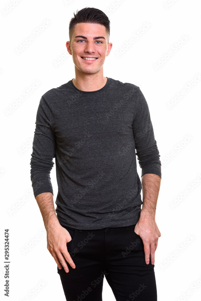 Studio shot of young happy handsome man smiling Studio shot of young happy handsome man smiling