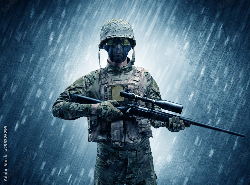 Armed soldier standing in rainy weather Armed soldier standing in rainy weather
