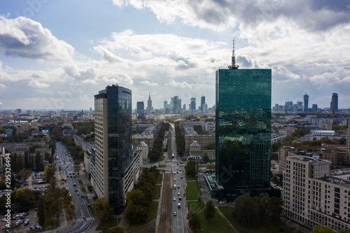 Aerial view of an urban metropolis with modern architecture and buildings at sunset. Warsaw. Poland. 19. September. 2019. Drone shot on cityscape business downtown.