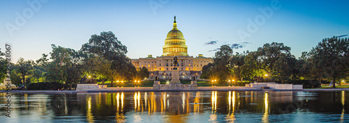 Panoramic image of the Capitol of the United States with the capitol reflecting pool in morning light. © Jason Yoder