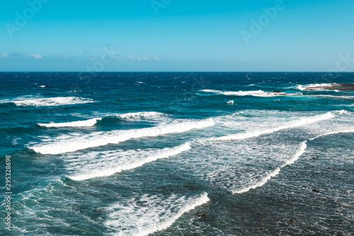 ocean landscape, sea waves on sunny day with blue sky