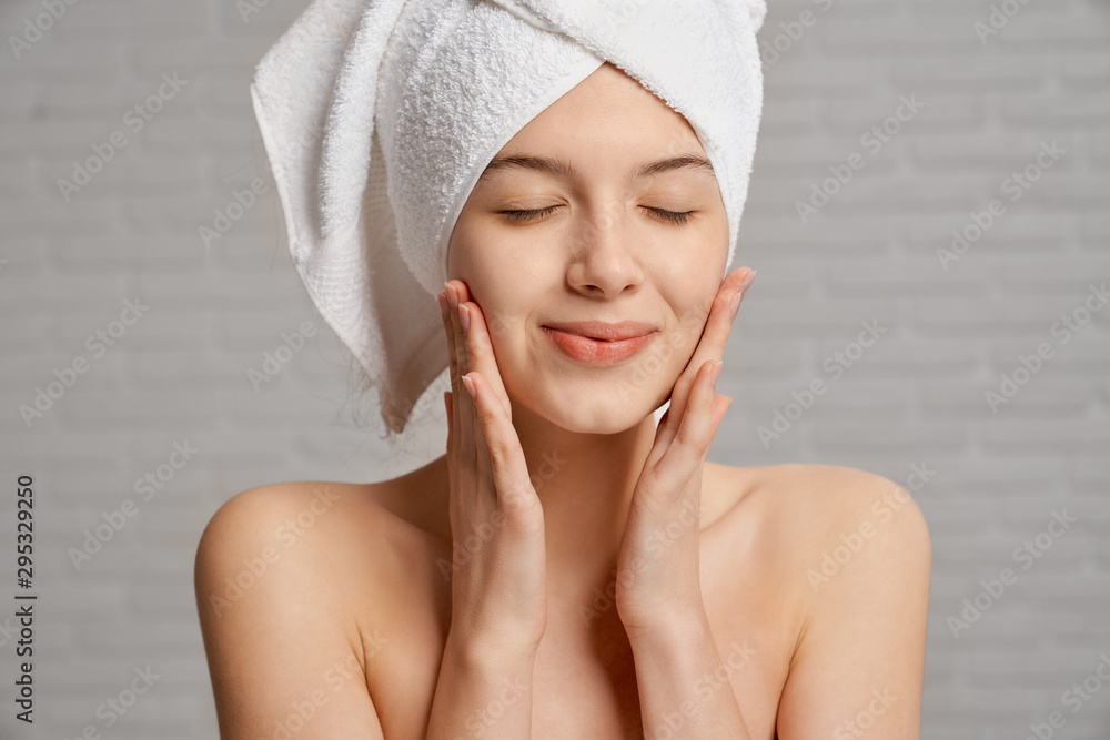 Woman with closed eyes on background of grey brick wall. Woman with closed eyes on background of grey brick wall.