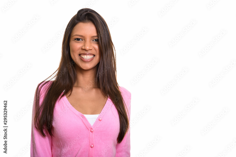 Studio shot of young happy Brazilian woman smiling Studio shot of young happy Brazilian woman smiling