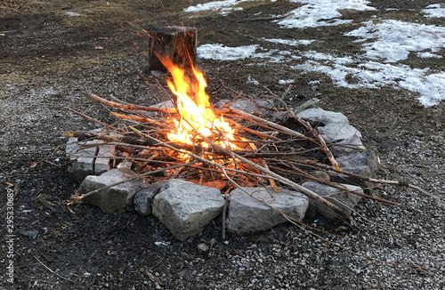 Camp fire in a rock firepit