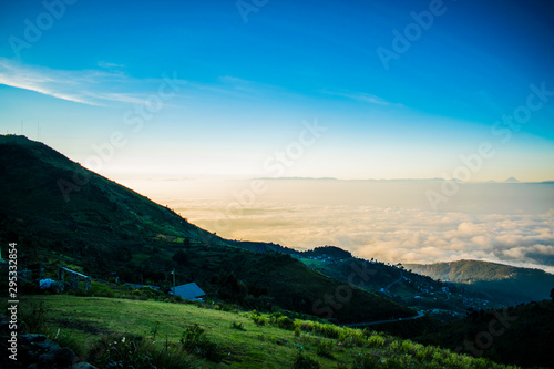 paisaje desde la cumbre, nubes cubriendo el valle de huehuetenango photo
