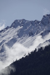 Tableau sur plexiglas  beautiful view in autumn to the alps with fresh snow and fog  © DoreenB. Photography
