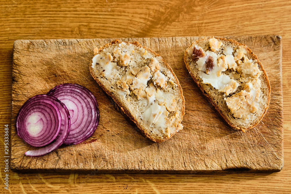 Bread with lard and greaves on cutting board Bread with lard and greaves on cutting board