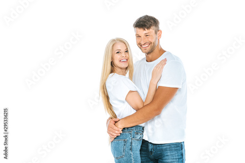 happy man laughing while hugging woman isolated on white
