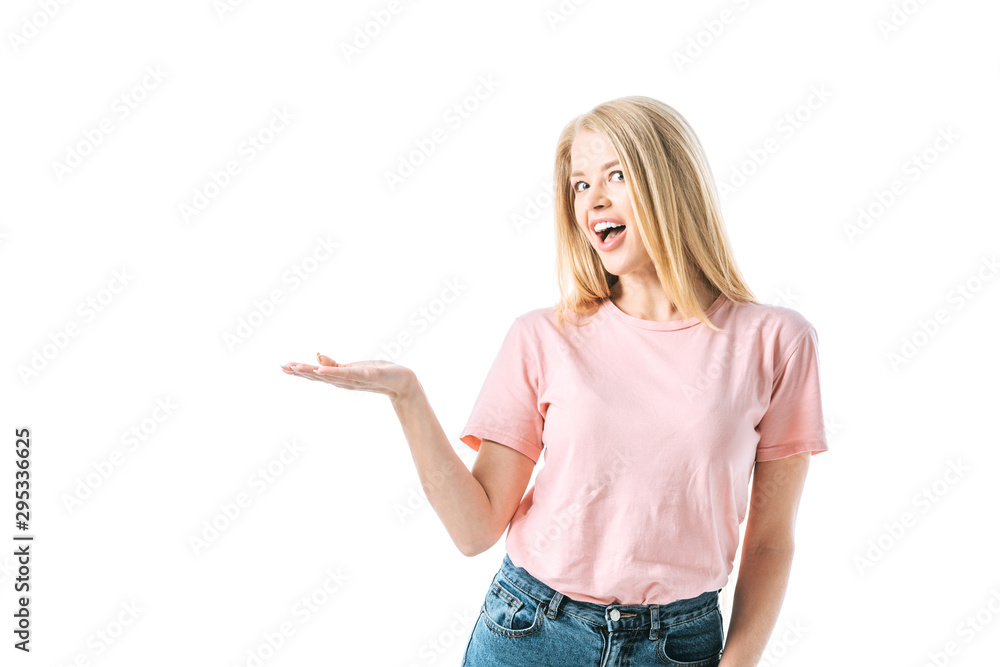 Fototapeta premium happy woman with opened mouth pointing with hand isolated on white