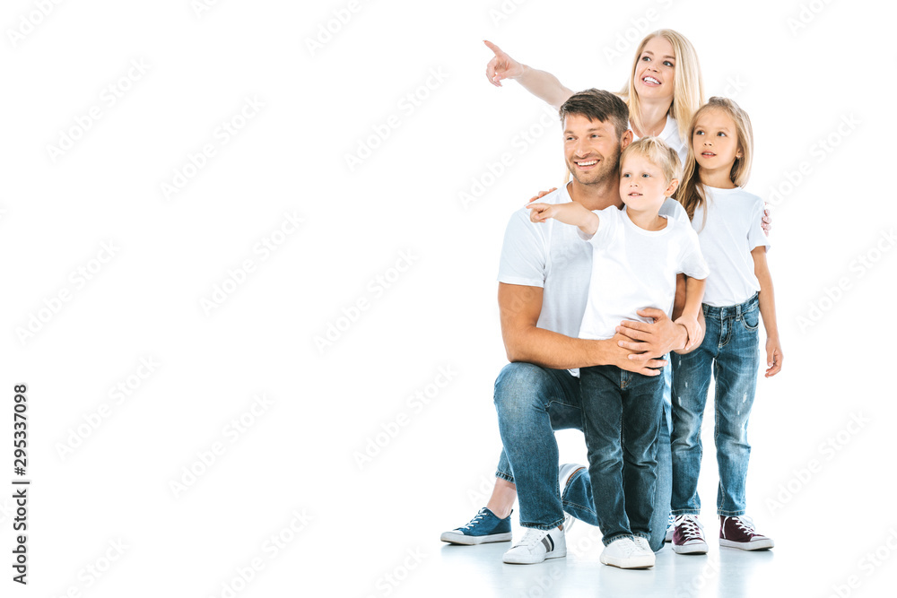 positive family in denim jeans pointing with fingers on white positive family in denim jeans pointing with fingers on white
