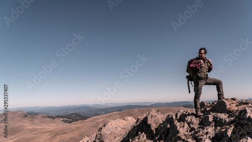 Wallpaper Mural Campers tourist with backpacks in the mountains. Climb to the top mountains  K Torontodigital.ca