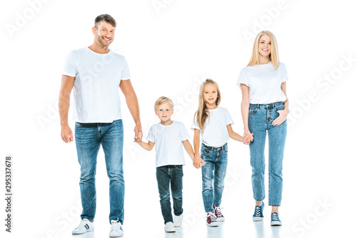 smiling parents holding hands with cheerful kids on white