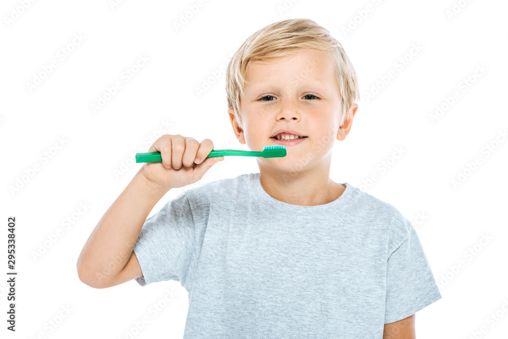 happy boy holding toothbrush isolated on white happy boy holding toothbrush isolated on white