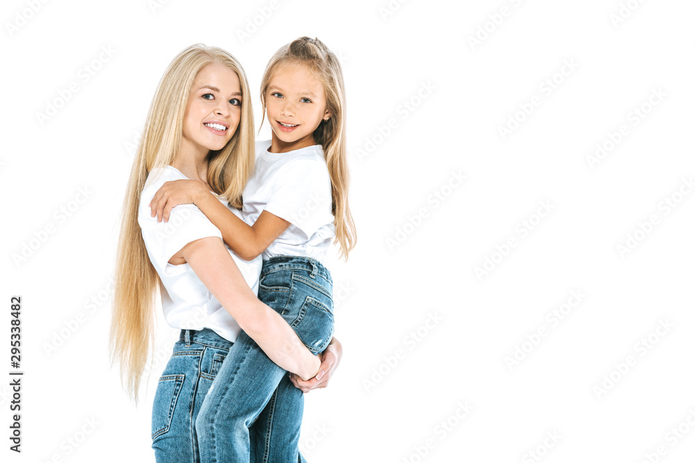 cheerful mother holding in arms daughter isolated on white cheerful mother holding in arms daughter isolated on white