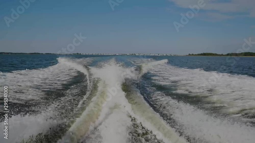 Waves and wake created by fishing boat going out into Chesapeake Bay