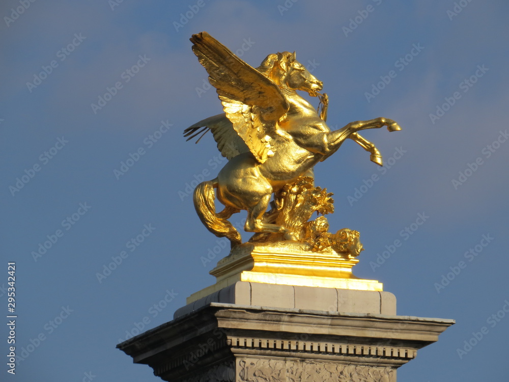 Paris, France - October 13, 2015: Close up of a golden winged horse statue in Paris France on a sunny day
