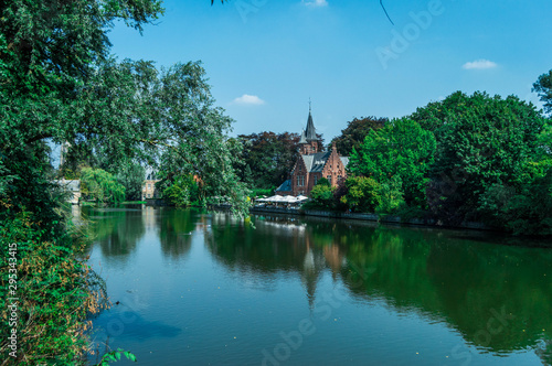 Photograph of a lake with green tones located near the park of love in Bruges.