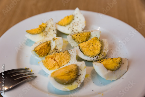 Boiled eggs with salt pepper and olive oil