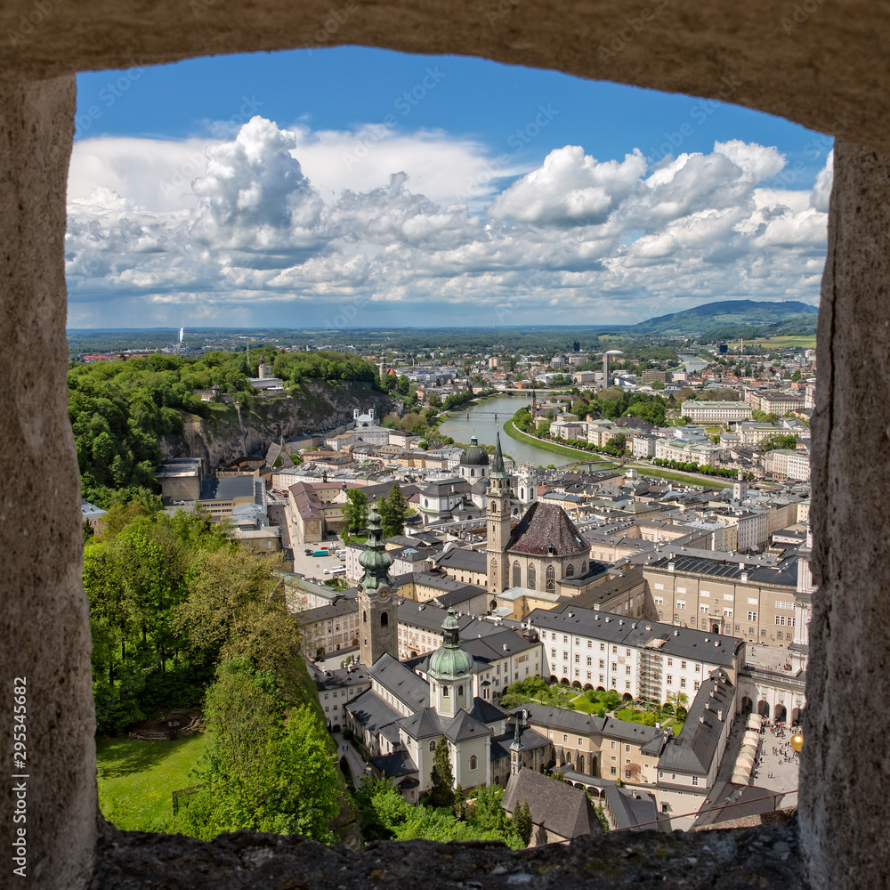 Great view of Salzburg through a window. The old town of Salzburg seen from the fortress Hohensalzburg with its many historical attractions, Austria
