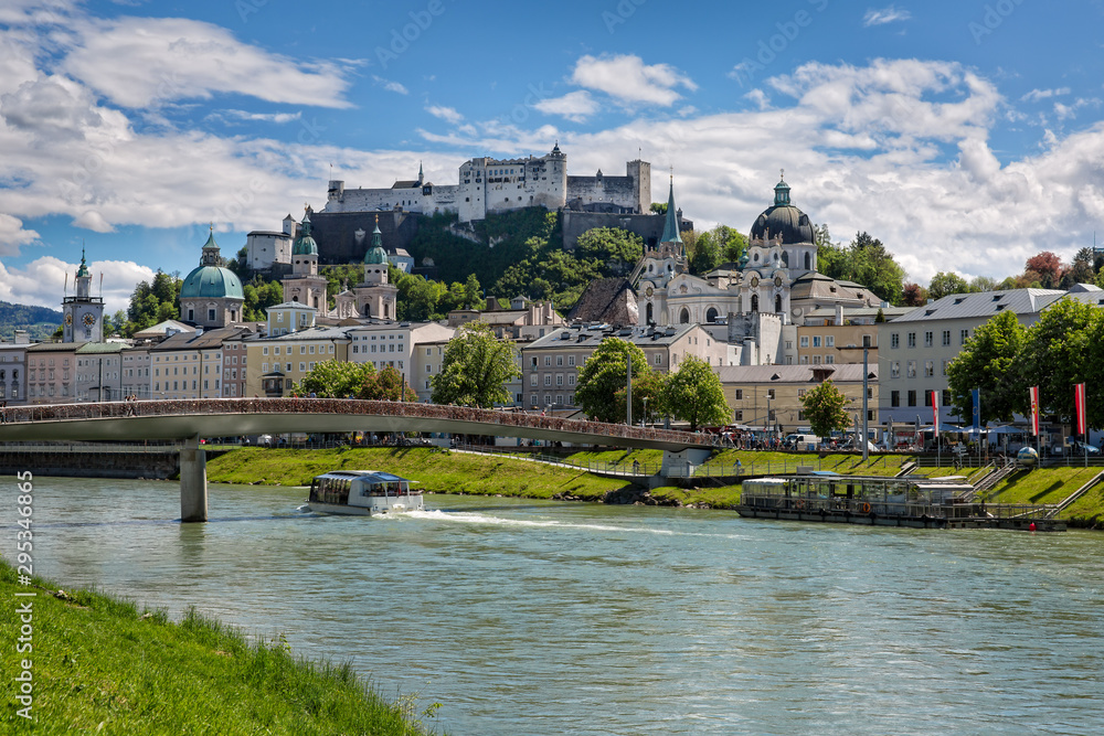 Festung Hohensalzburg tourist magnet. Great view on Festung Hohensalzburg with Salzach river and Makartsteg bridge in Salzburg, Austria