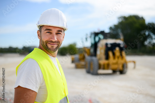 Obraz na płótnie portrait of handsome foreman construction worker on a industrial building indust