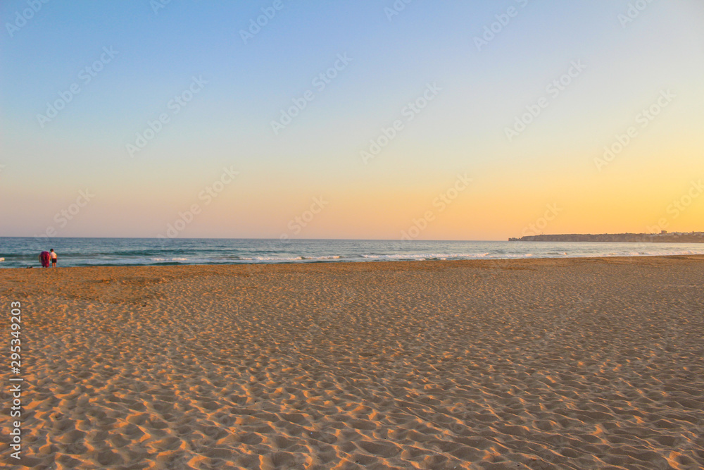 Sunset in Praia de Albandeira - beautiful coast of Algarve at sunset, Portugal