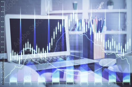 Forex market chart hologram and personal computer background. Double exposure. Concept of investment.