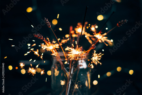 Sparklers in a glass jar that bokeh x-mas 2020 background