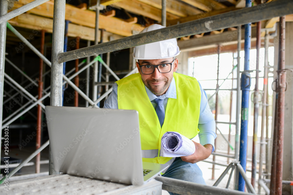 portrait of handsome foreman construction worker on a industrial building industry construction site portrait of handsome foreman construction worker on a industrial building industry construction site