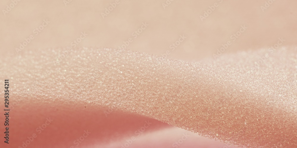 White pink artificial foam, soft texture on a light background. White pink artificial foam, soft texture on a light background.