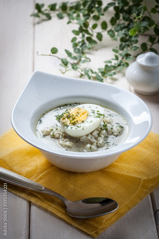 Sorrel soup with egg in white bowl. Sorrel soup with egg in white bowl.