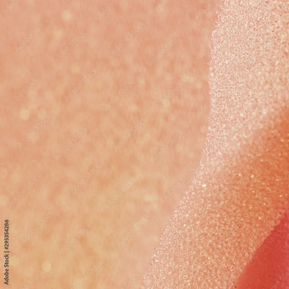 Fototapeta premium White pink artificial foam, soft texture on a light background.