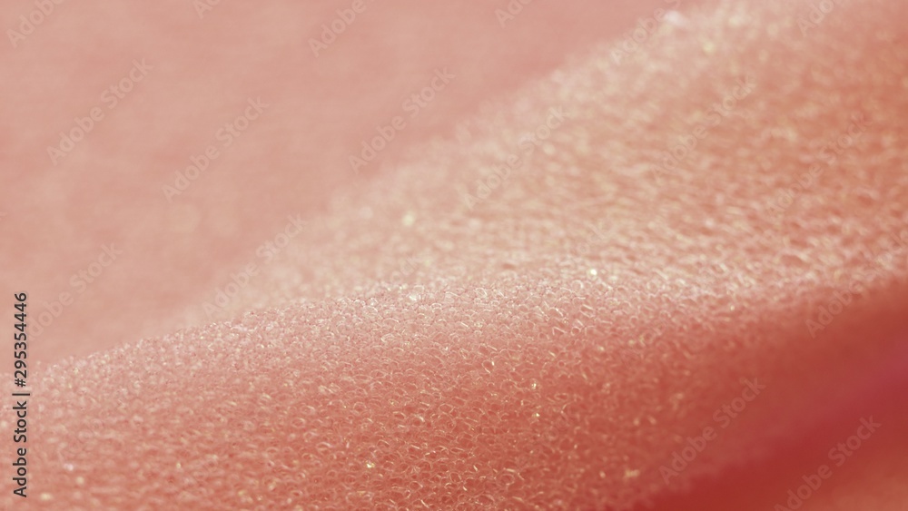 White pink artificial foam, soft texture on a light background. White pink artificial foam, soft texture on a light background.