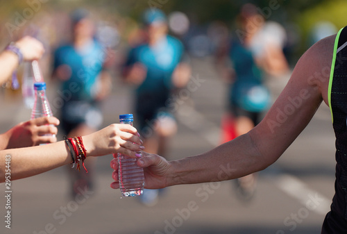 Canvas Print Drinks station at a running marathon, hydration drinking during a race
