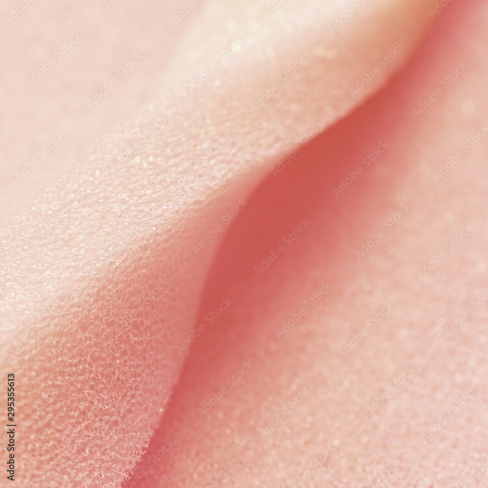 White pink artificial foam, soft texture on a light background.