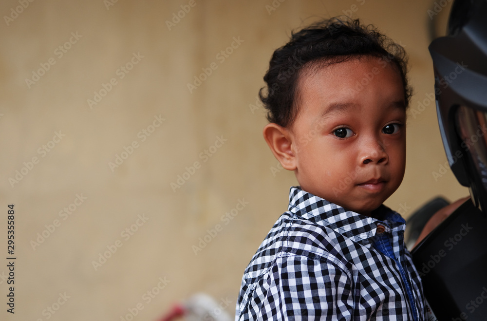 Portrait of an Asian little boy. Cute Indonesian kid at home. Portrait of an Asian little boy. Cute Indonesian kid at home.