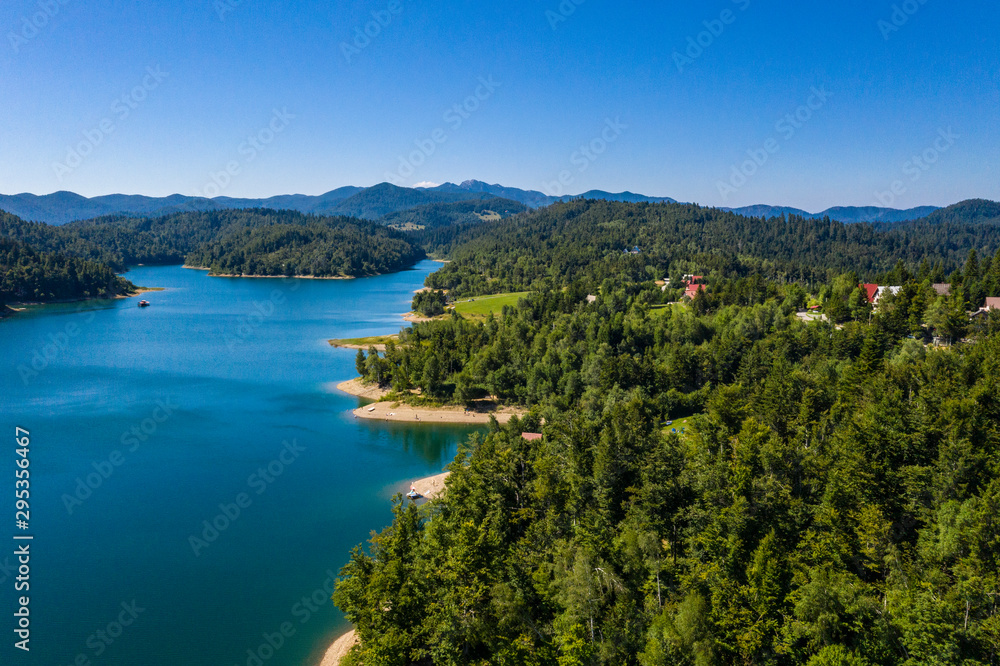 Fototapeta premium Aerial panoramic view of Lokvarsko Lake, beautiful mountain landscape on sunny summer day, Lokve, Gorski kotar, Croatia