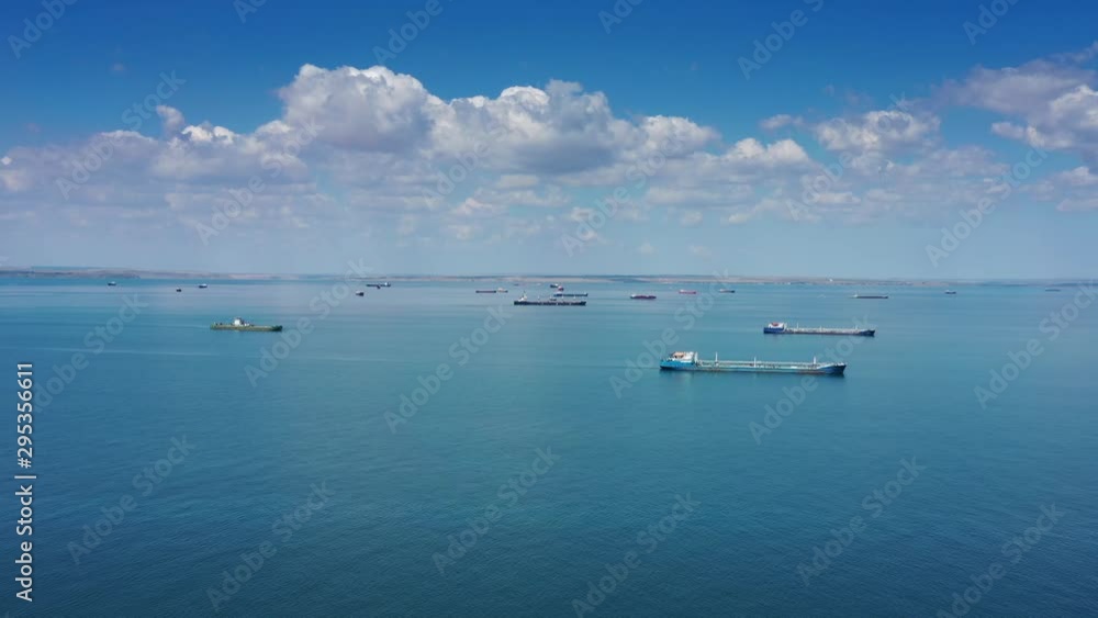 Aerial view of many cargo ships waiting for port entrance, 4k Aerial view of many cargo ships waiting for port entrance, 4k