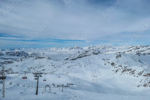 Beautiful and serene landscape of mountains covered with snow in Mölltaler Gletscher, Austria. Thick snow covers the slopes. Clear weather. Massive skiing resort. Glacier skiing