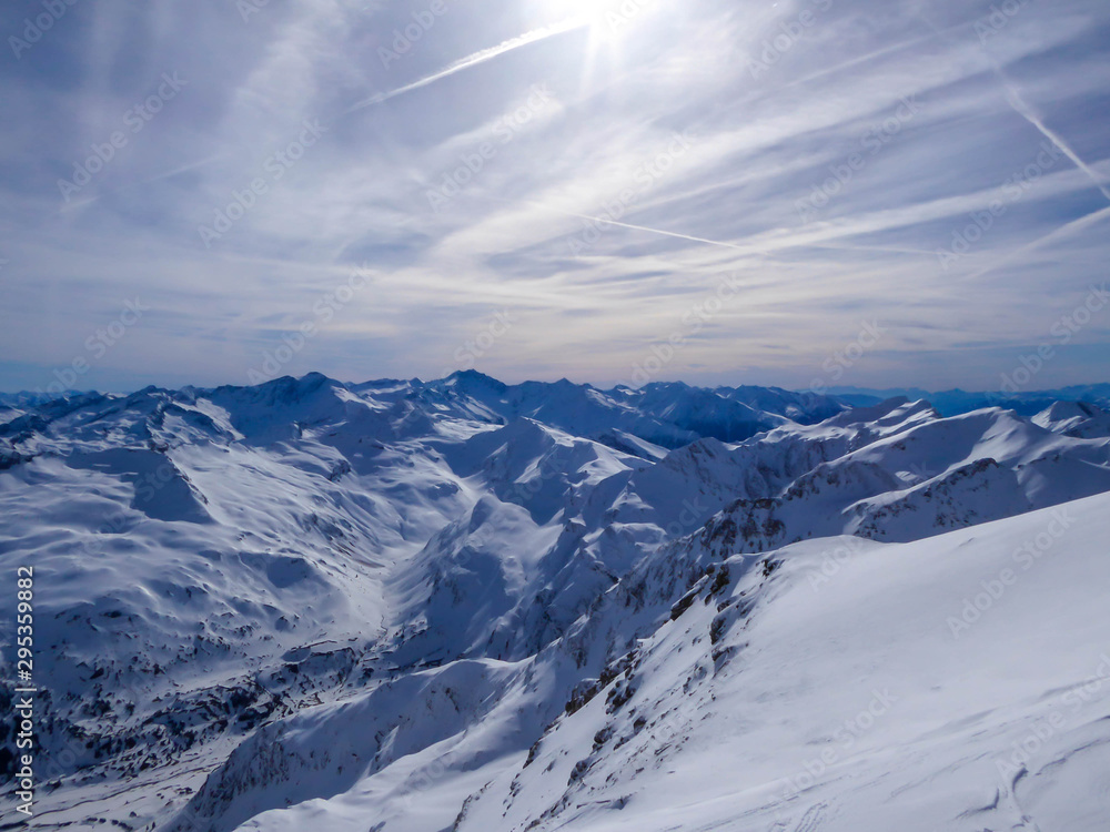 Beautiful and serene landscape of mountains covered with snow in Mölltaler Gletscher, Austria. Thick snow covers the slopes. Clear weather. Perfectly groomed slopes. Massive ski resort. Glacier skiing