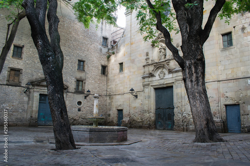 Plaza de Sant Felip Neri, square with the fountain in gothic quarter, Barcelona photo
