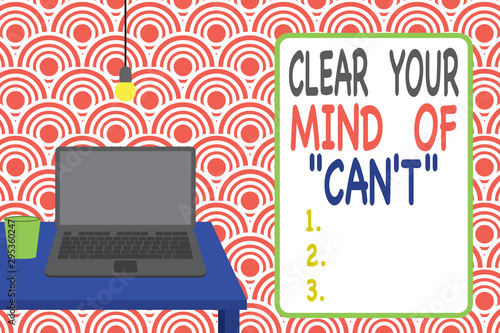 Conceptual hand writing showing Clear Your Mind Of Can T. Concept meaning Have a positive attitude thinking motivation Front view laptop lying on wooden desktop light bulb glass