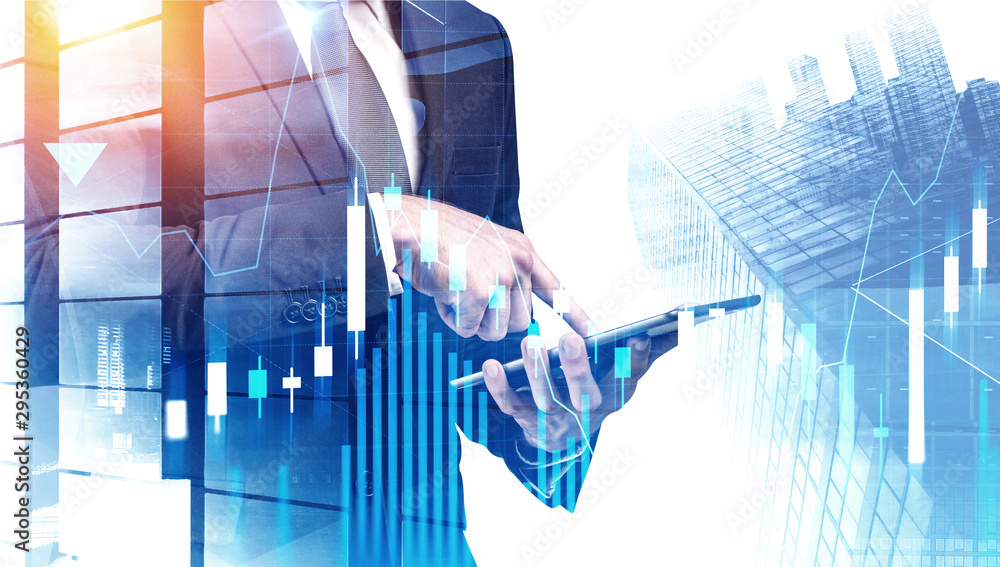 Businessman with tablet in city, forex graph Businessman with tablet in city, forex graph