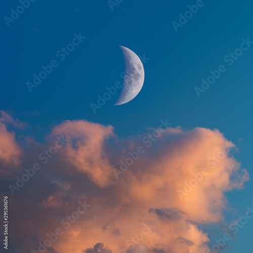 Moon and clouds at sunset