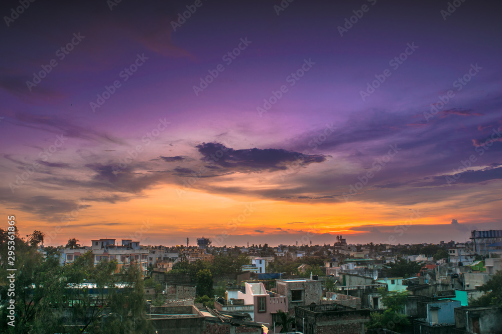 Cityscape from rooftop a colorful sunset