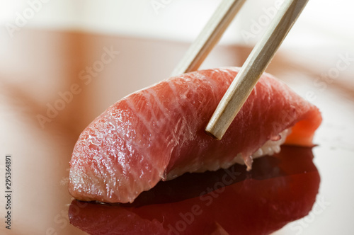 nigiri tuna fish otoro with wood chopstick japan 