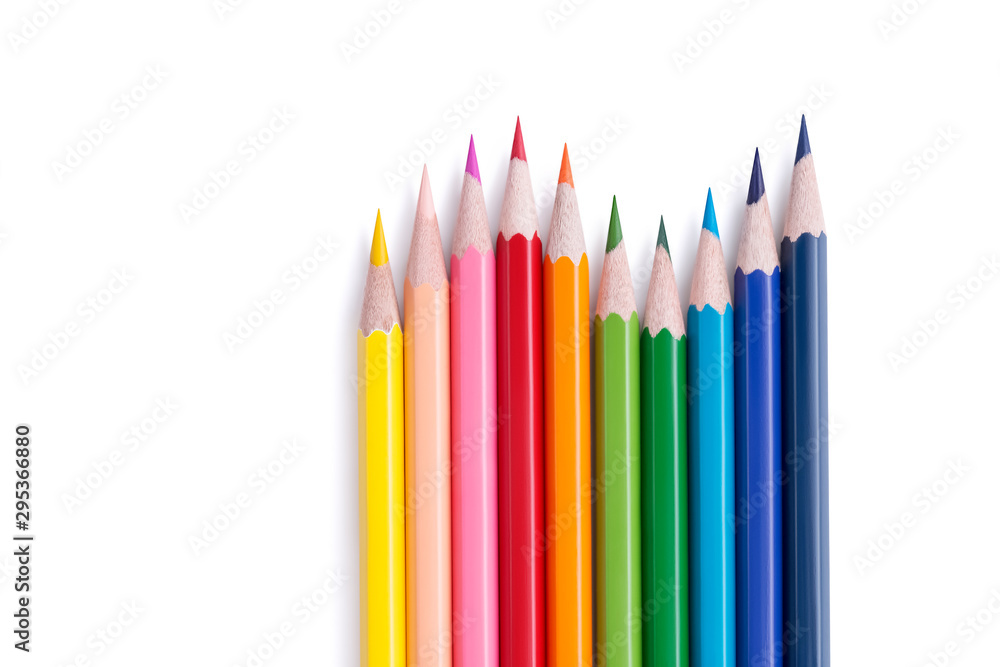 Fototapeta premium Set of bright multicolored wooden pencils lying in the form of a wave with copy space for text isolated on white background