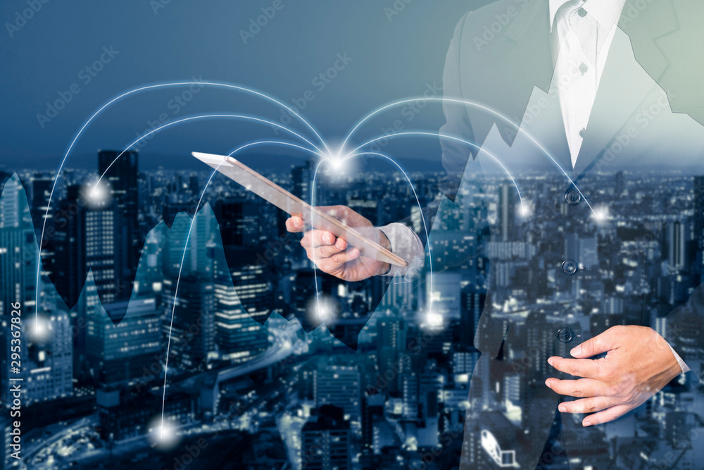 Double exposure businessman in trading business graph and city connection network background