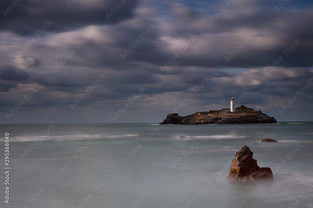 Stormy skies over Godrevy Lighthouse St Ives Bay Cornwall UK